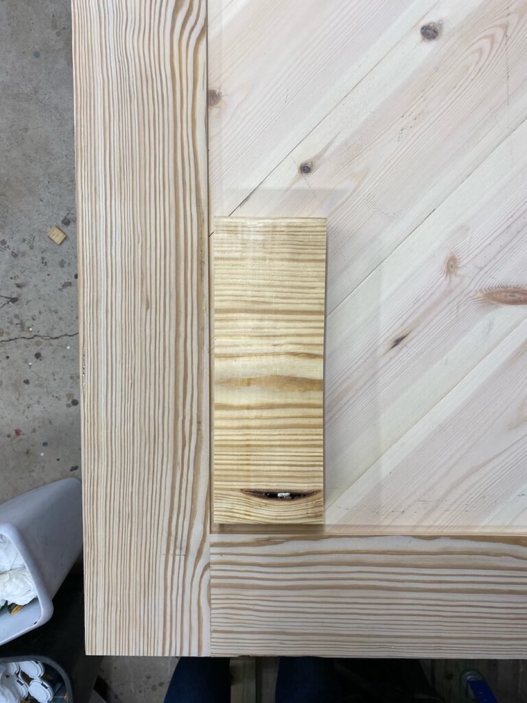 Yellow pine boards, one lighter, and less yellow in color than the other due to wood bleaching.