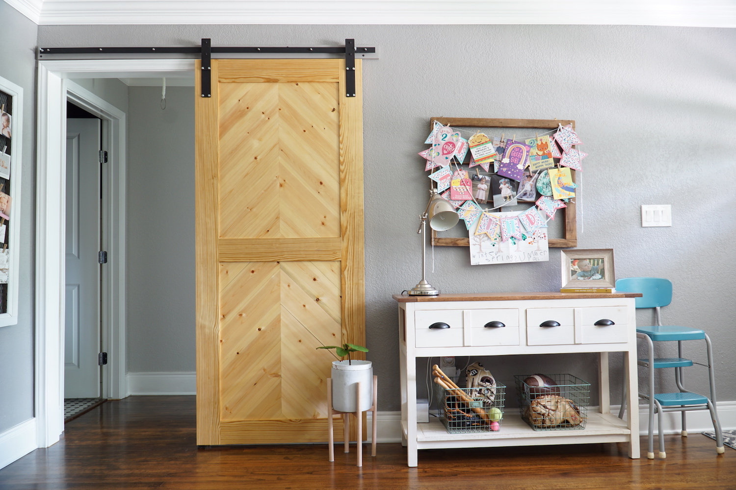 Herringbone barn door used for a hallway opening.
