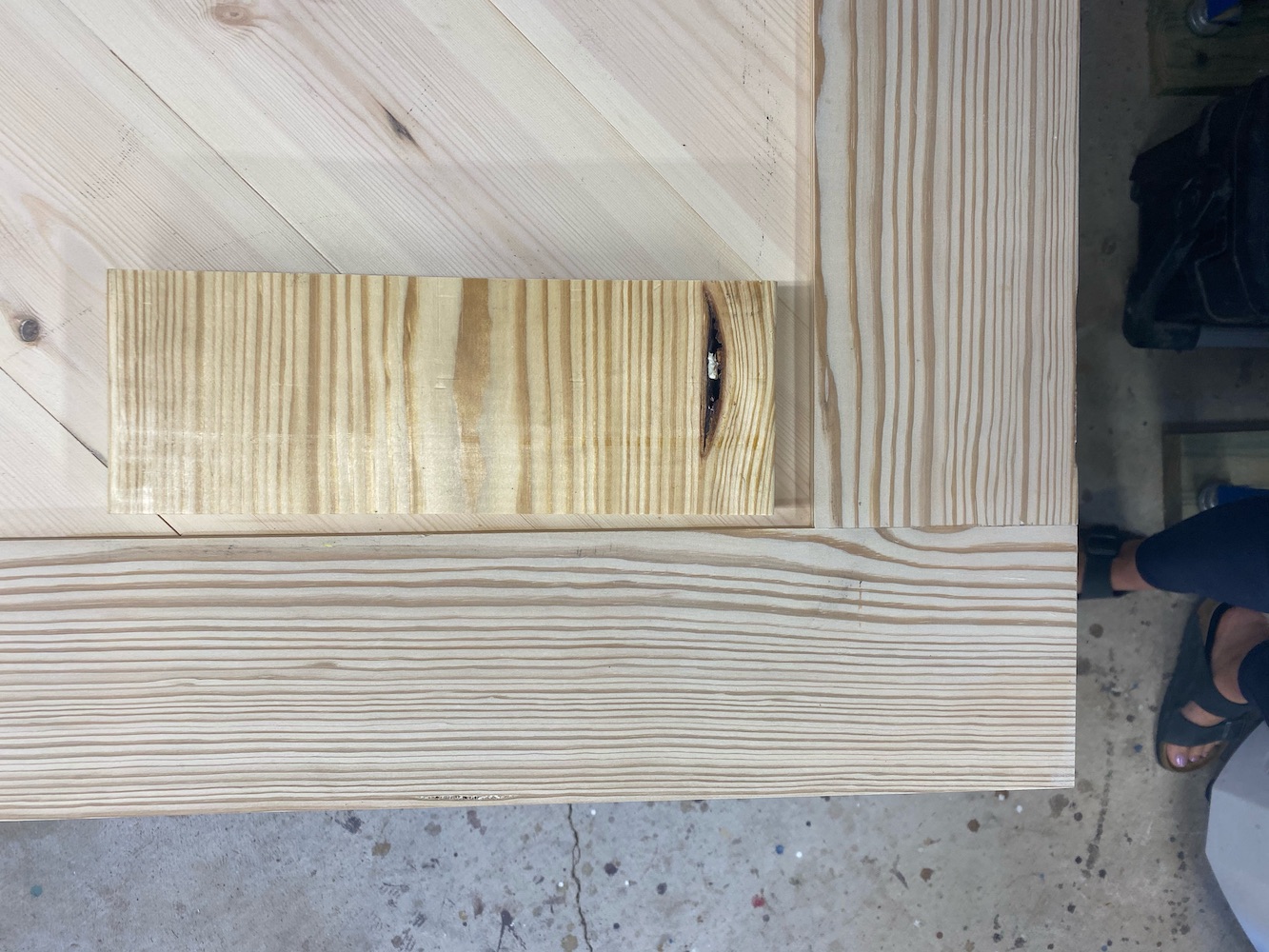 Yellow pine boards, one lighter, and less yellow in color than the other due to wood bleaching.